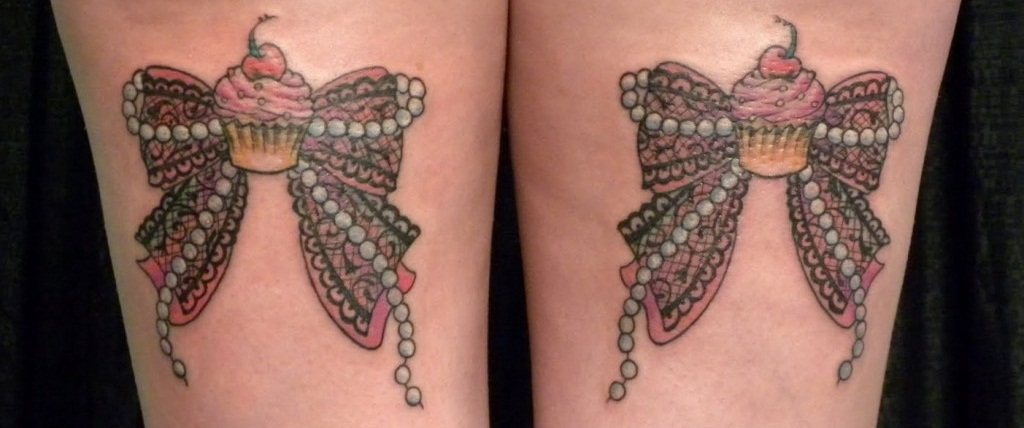 9. Bow tattoos on the back of thighs: a subtle and sexy placement option - wide 5