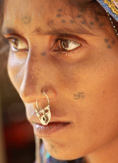 Indian Tribal Woman Three Dot Tattoo Near Eye