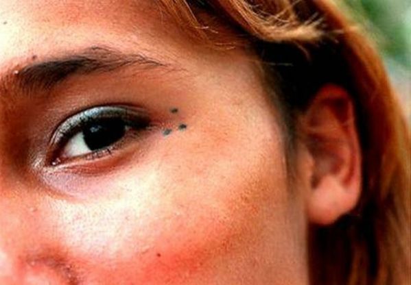 Three Dot Tattoo On Face