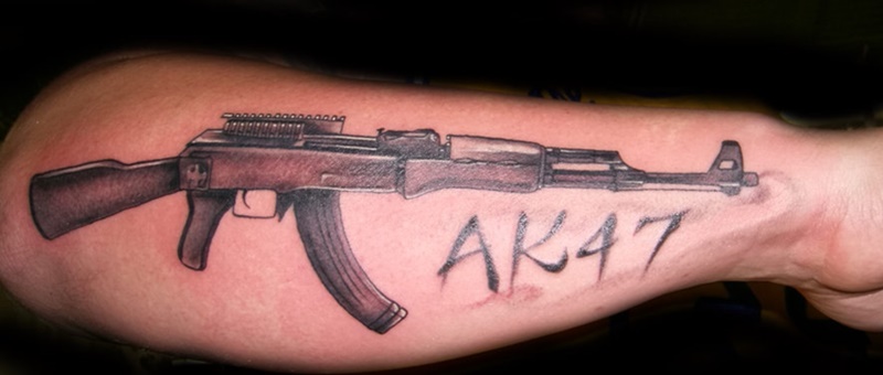 Ak47 tattoo on arm.