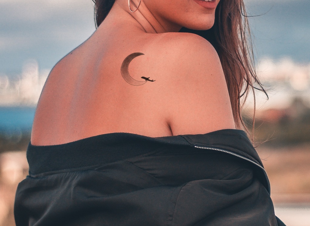 Crescent Moon With Aircraft Tattoo On Back