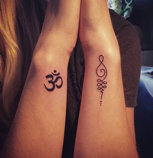 Unalome tattoo and Om tattoo on both hand.
