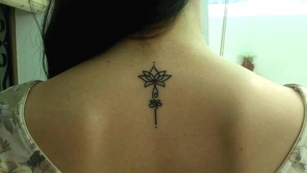 Unalome with lotus tattoo on back