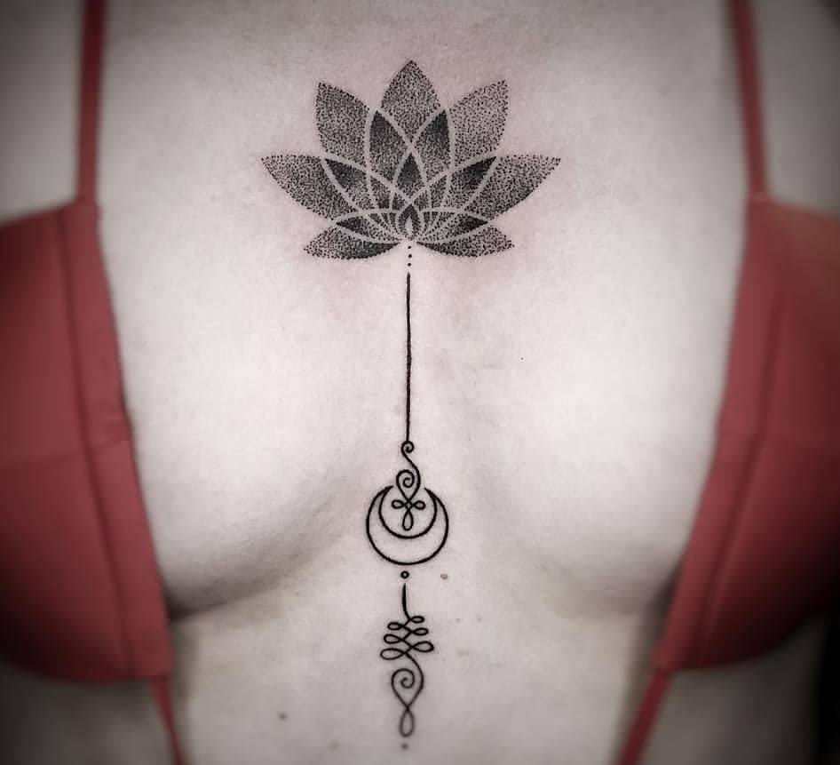 Unalome with moon and lotus tattoo between breast.