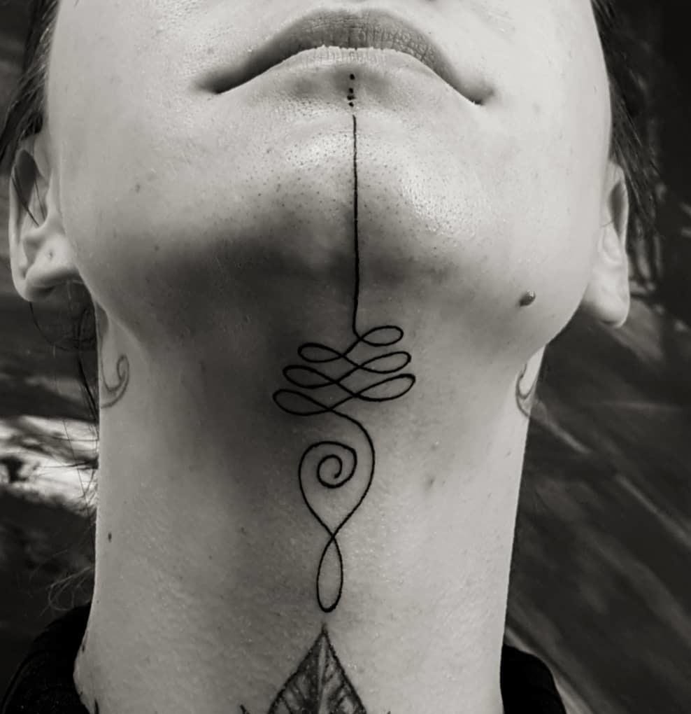 Unalome tattoo on throat.