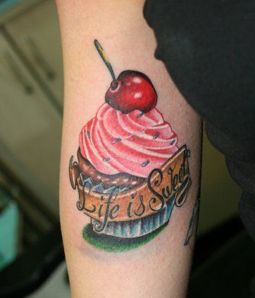 Ice Cream cup with cherry tattoo with Life is Sweet written on it.