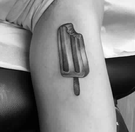 Ice Cream stick tattoo on bicep man