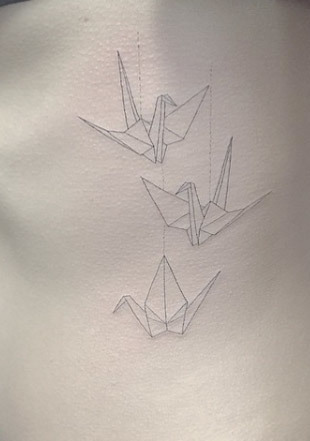 Origami String Bird/Crane Tattoo On Side Of A Woman