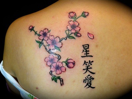 Japanese Kanji Tattoo With Pink Flower On Back