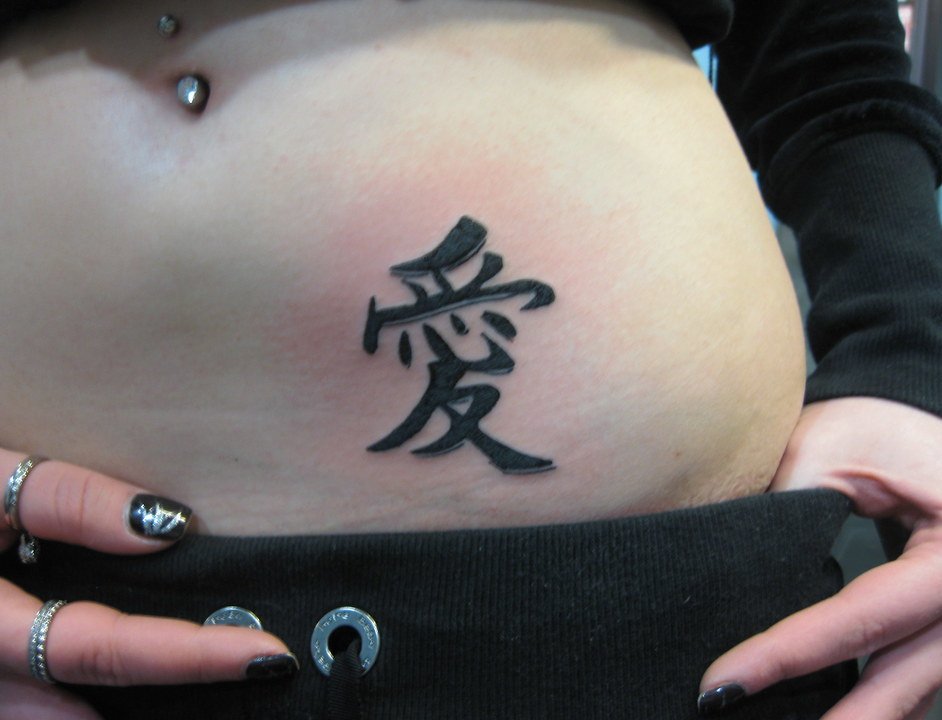 Kanji Tattoo On Belly Woman