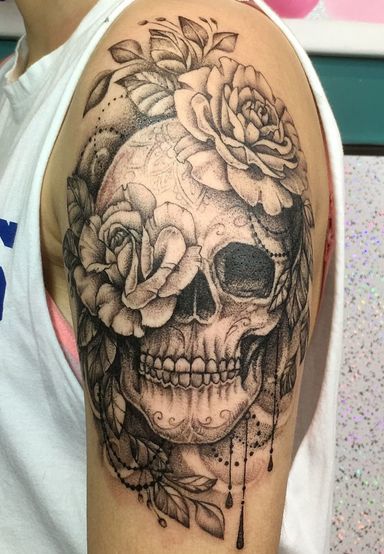 Rose And Skull Tattoo On Shoulder Of A Woman