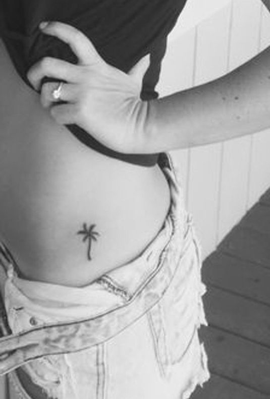 Palm Tree Tattoo On Waist Of A Girl