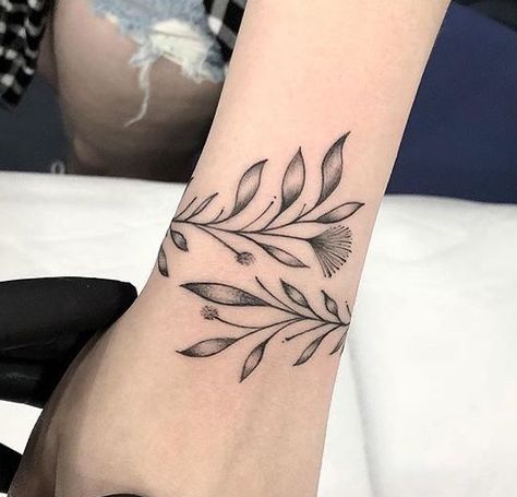 Plant Tattoo On Wrist Of A Girl