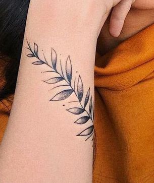 Plant Tattoo In Forearm of A Girl