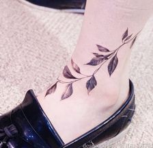 Plant Tattoo On Ankle Of A Girl
