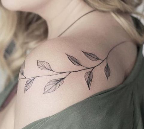 Plant Tattoo On Shoulder Of A Woman
