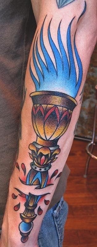 Fire Torch Tattoo on elbow