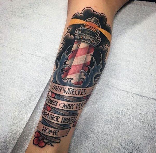 Lighthouse tattoo on leg.