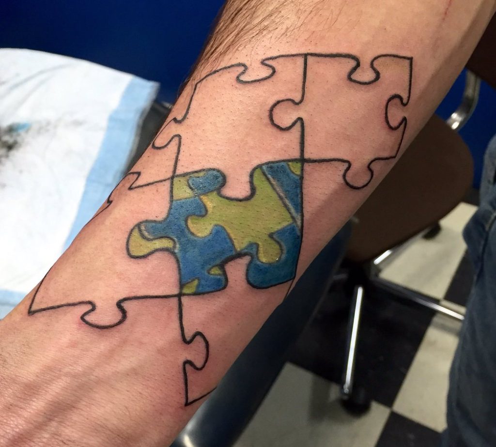 Puzzle Piece Tattoo on Hand.