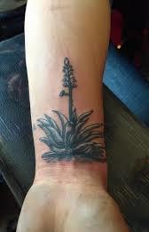 Agave with flower tattoo on wrist.
