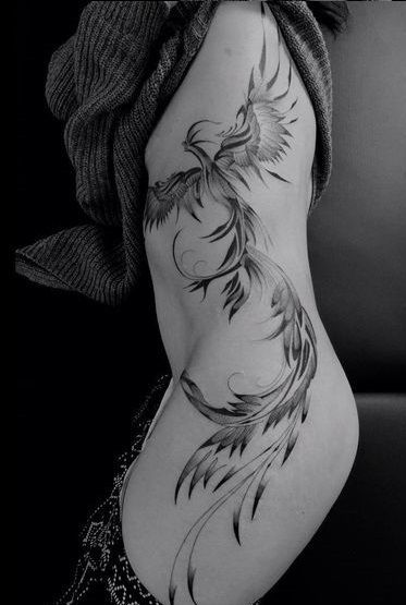 Phoenix Tattoo on side of a girl.