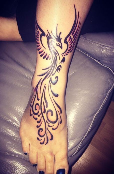 Phoenix Tattoo on leg of a woman.