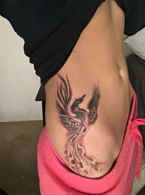 Phoenix Tattoo on Side of a woman.