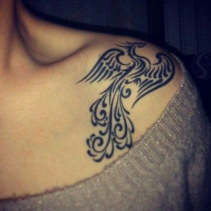 Phoenix Tattoo on shoulder of a girl.