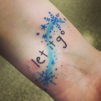 Snowflake Tattoo On Wrist with Let It Go written on it.