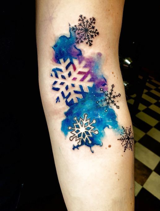 Water Color Snowflake Tattoo on Hand.