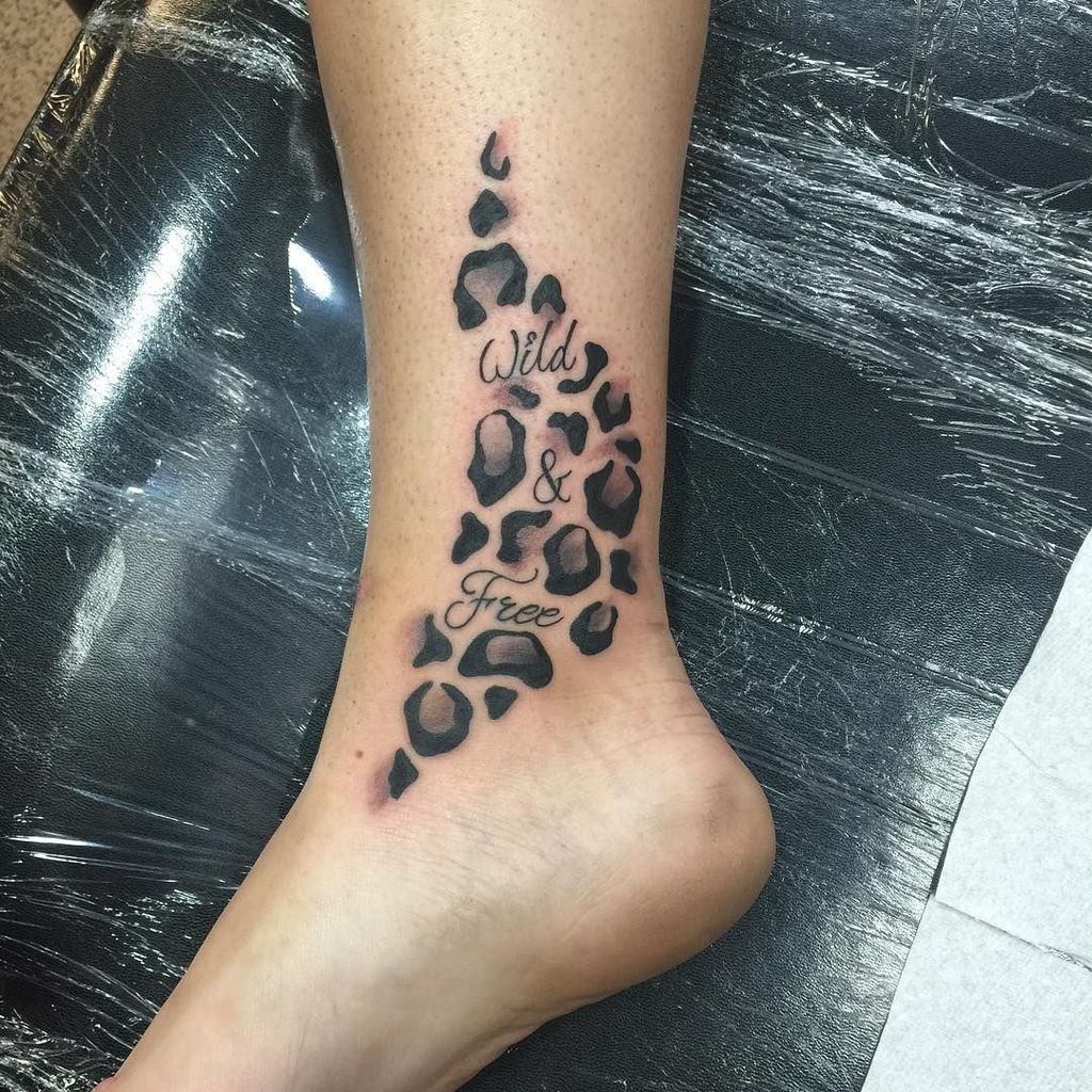 Black Color Cheetah Print Tattoo on leg