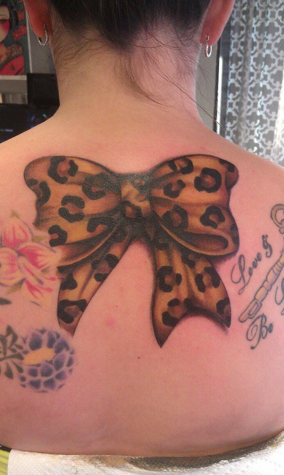 Cheetah Print Ribbon Tattoo at back