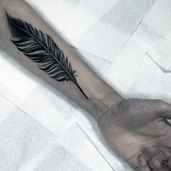 Bold Black Feather Tattoo for guys