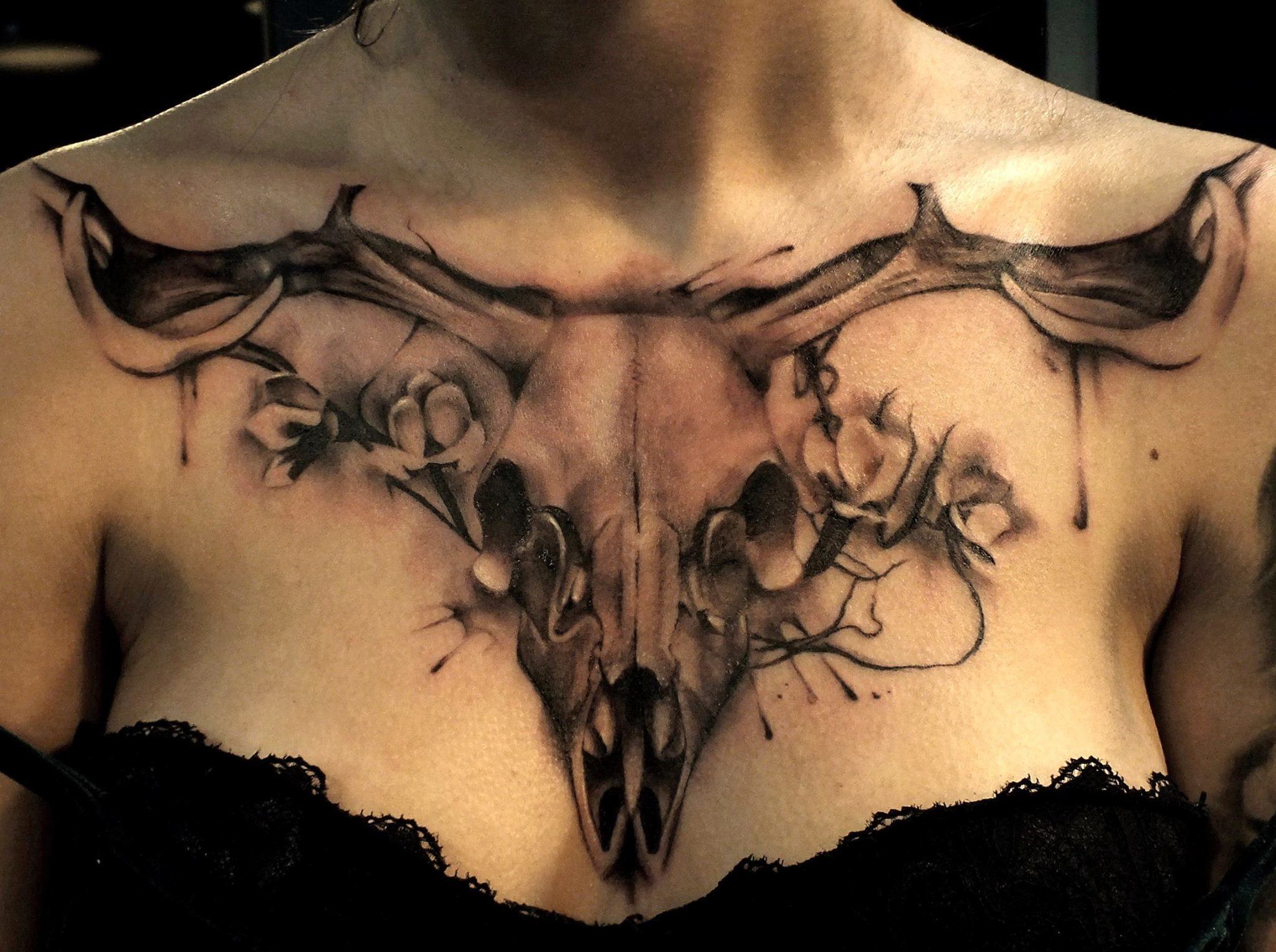 Longhorn Skull tattoo for women on chest.