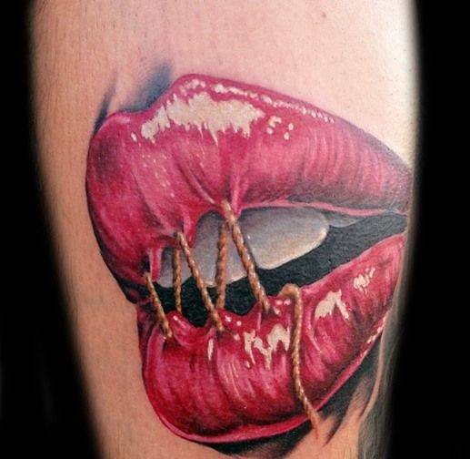 Sealed lip tattoo for men on leg