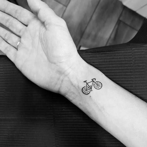 Small Cycle Tattoo on wrist for men