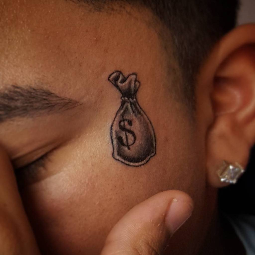 Money Bag Tattoo on face face men