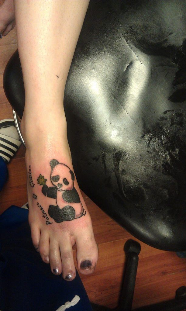 panda tattoo on leg