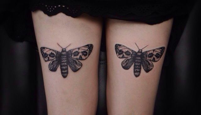 Moth tattoo on leg for women