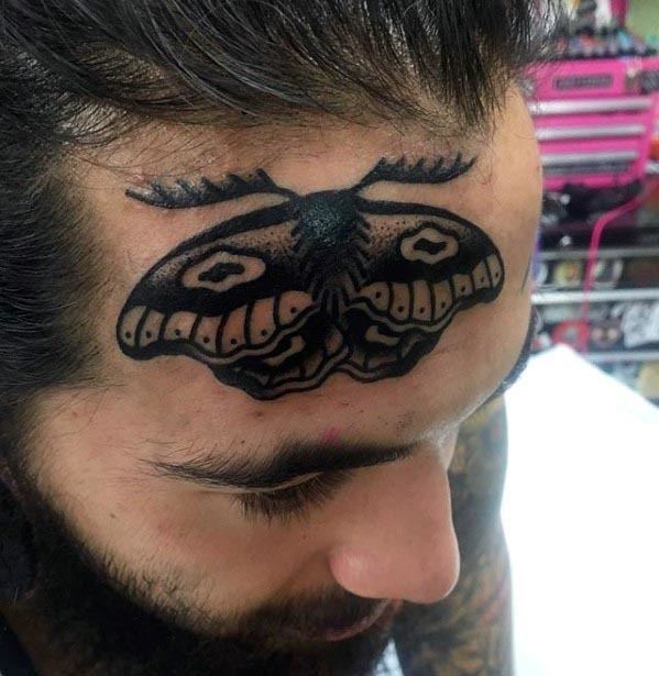 Moth tattoo on head for men