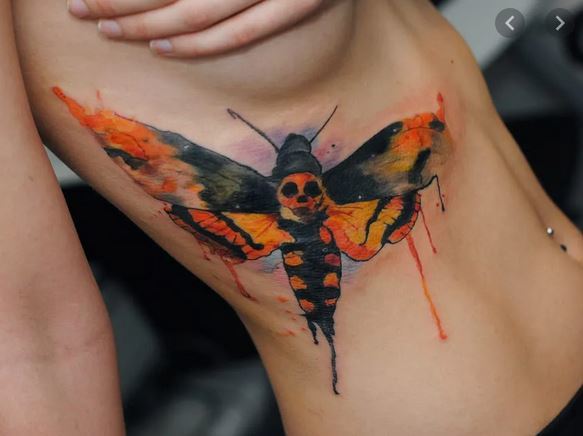 Dead Moth Tattoo On Side Of A Woman