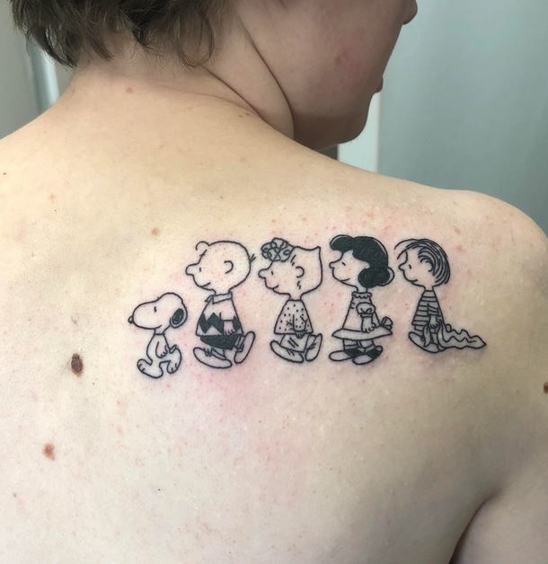 Outline of Charlie Brown and his friend Tattoo at back for women