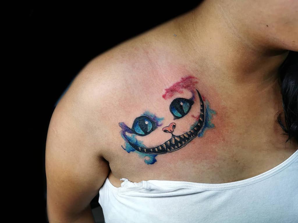 Beautiful Cheshire Cat tattoo on shoulder for women