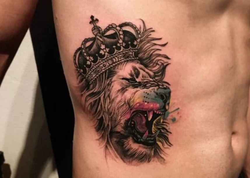 Lion with crown tattoo on body