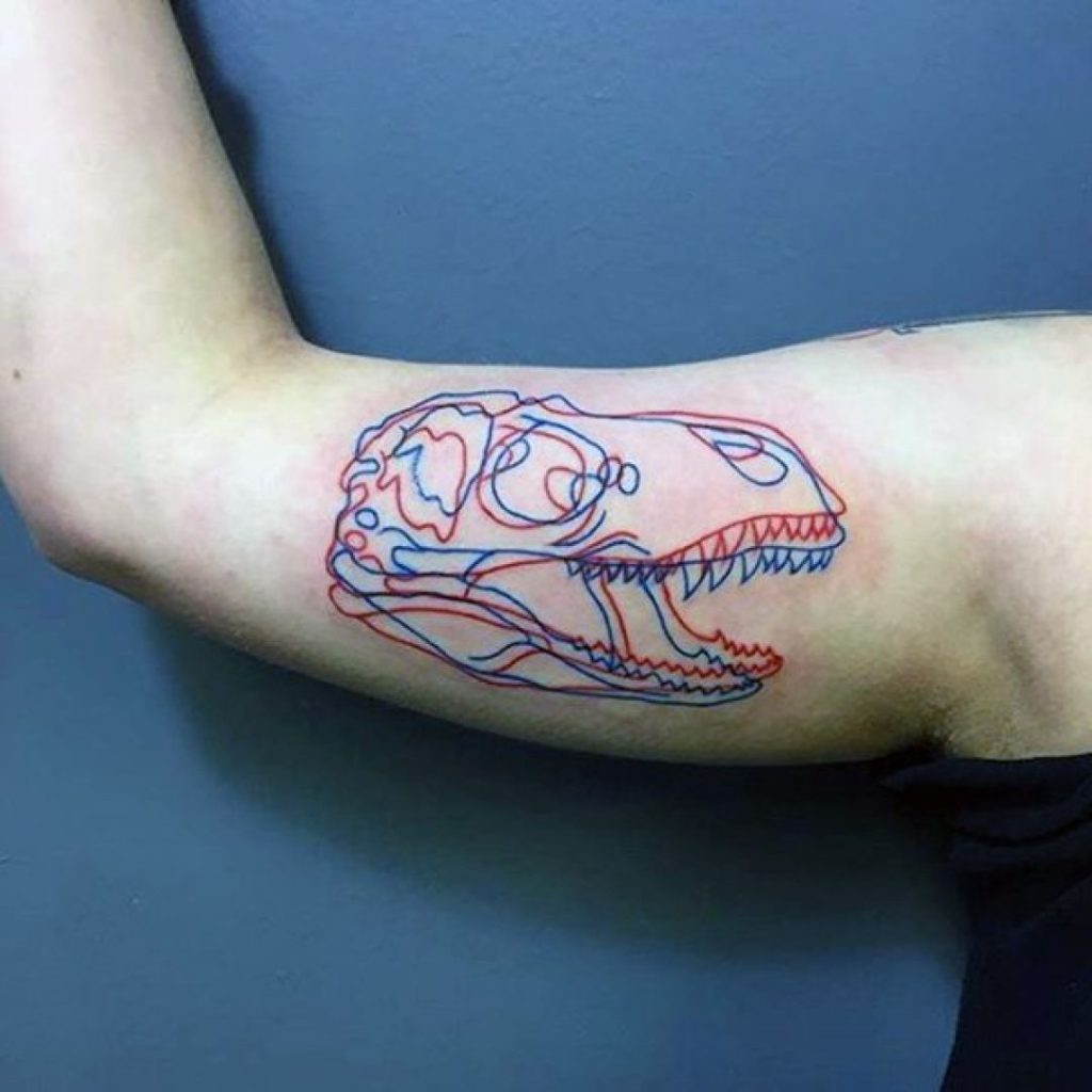 Dinosaur tattoo in arm for men