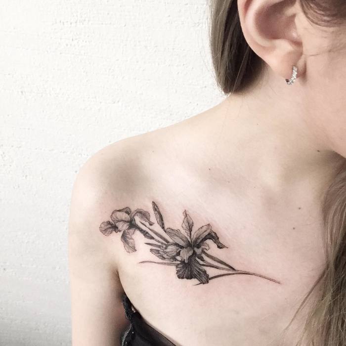 Black and grey Iris flower tattoo on shoulder for women
