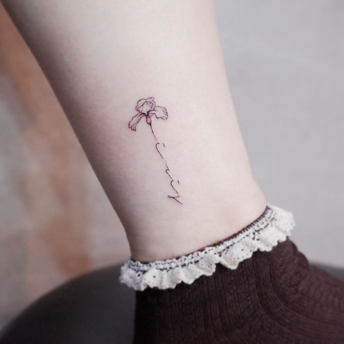 White Iris flower tattoo for women 