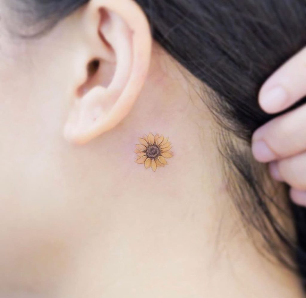 Sunflower tattoo behind ears for women
