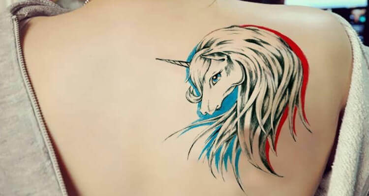 Unicorn tattoo at back for women