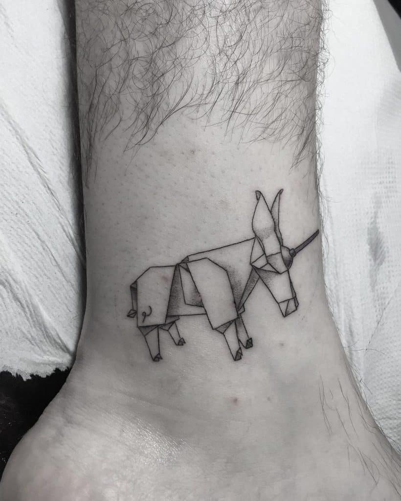 Paper Unicorn tattoo on leg for women